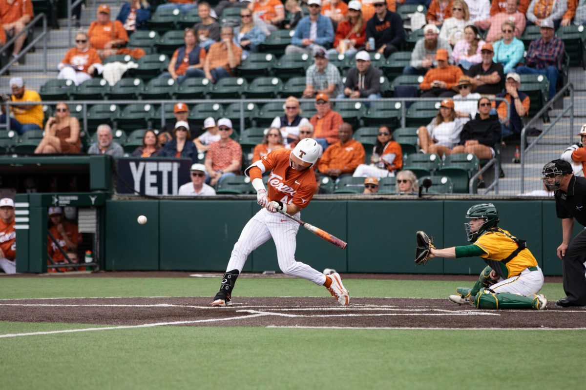 Sophomore Max Belyeu prepares to hit ball during game against Baylor University on Sunday. The Longhorns beat the Bears 11-1.
