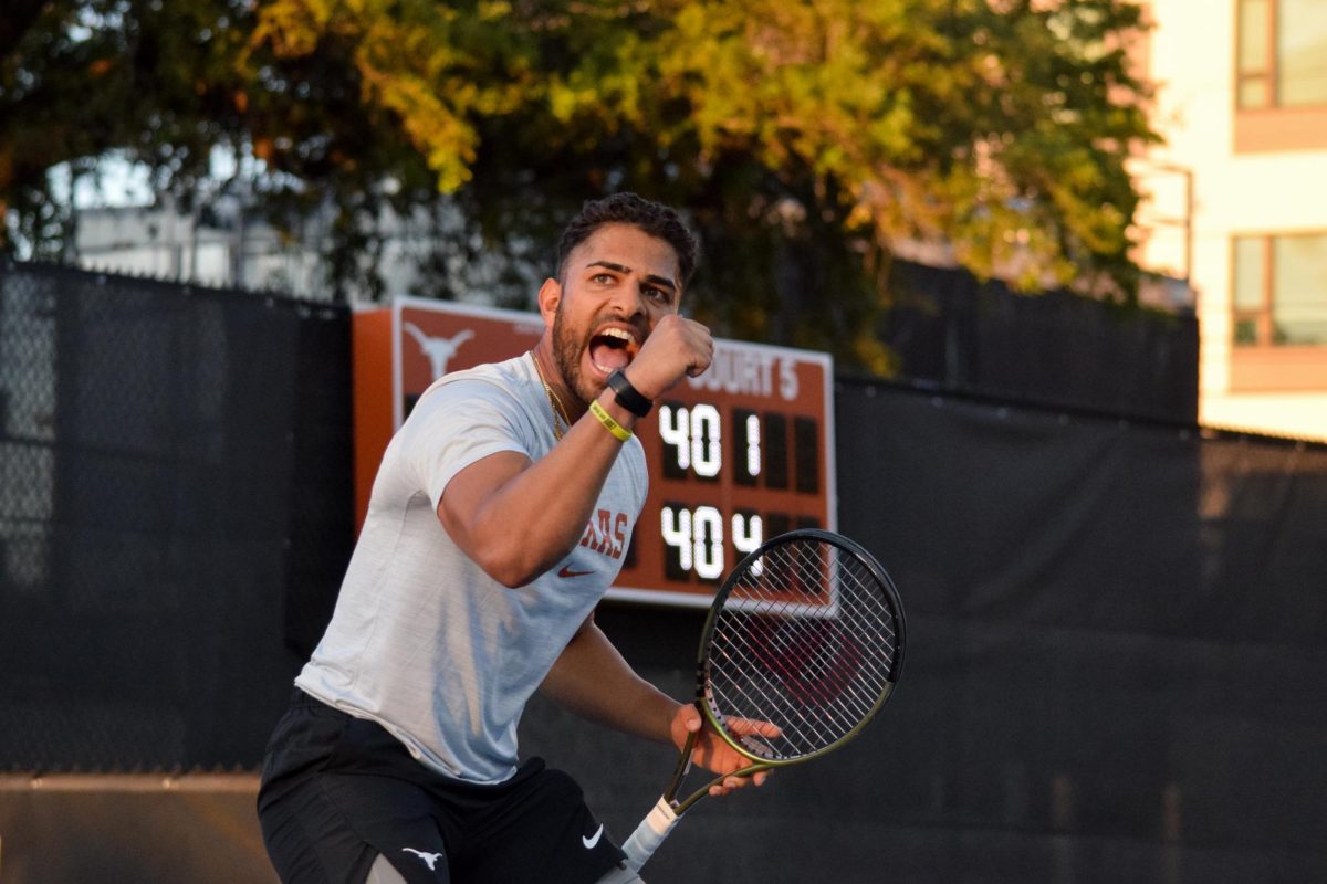 Senior tennis player Eshan Talluri celebrates during Texas doubles match against UCF on Friday, March 22, 2024. Eshan and junior Pierre-Yves Bailly beat UCF players Liam Branger and Lleyton Cronje 6-2. 