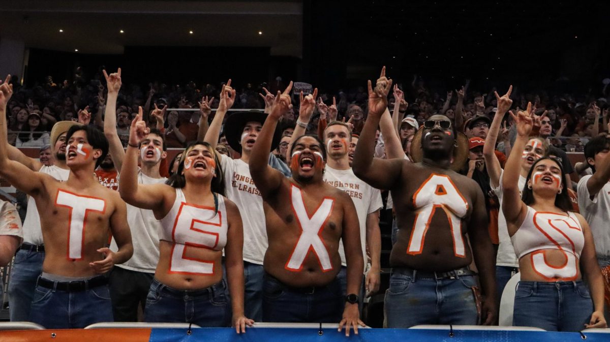 The Texas Hellraisers shout Texas Fight during the 4th quarter of Texas game against Alabama on Sunday. The Longhorns defeated the Crimson Tide 65-54, to advance to the Sweet Sixteen.
