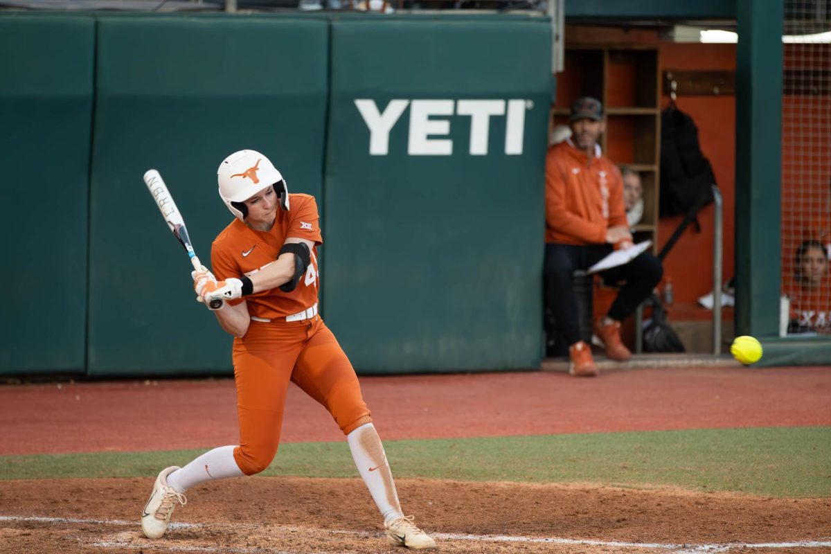 Sophomore Leighann Goode prepares to hit the ball during a game against Tarleton State on Friday. The Longhorns beat the Texans 17-0.