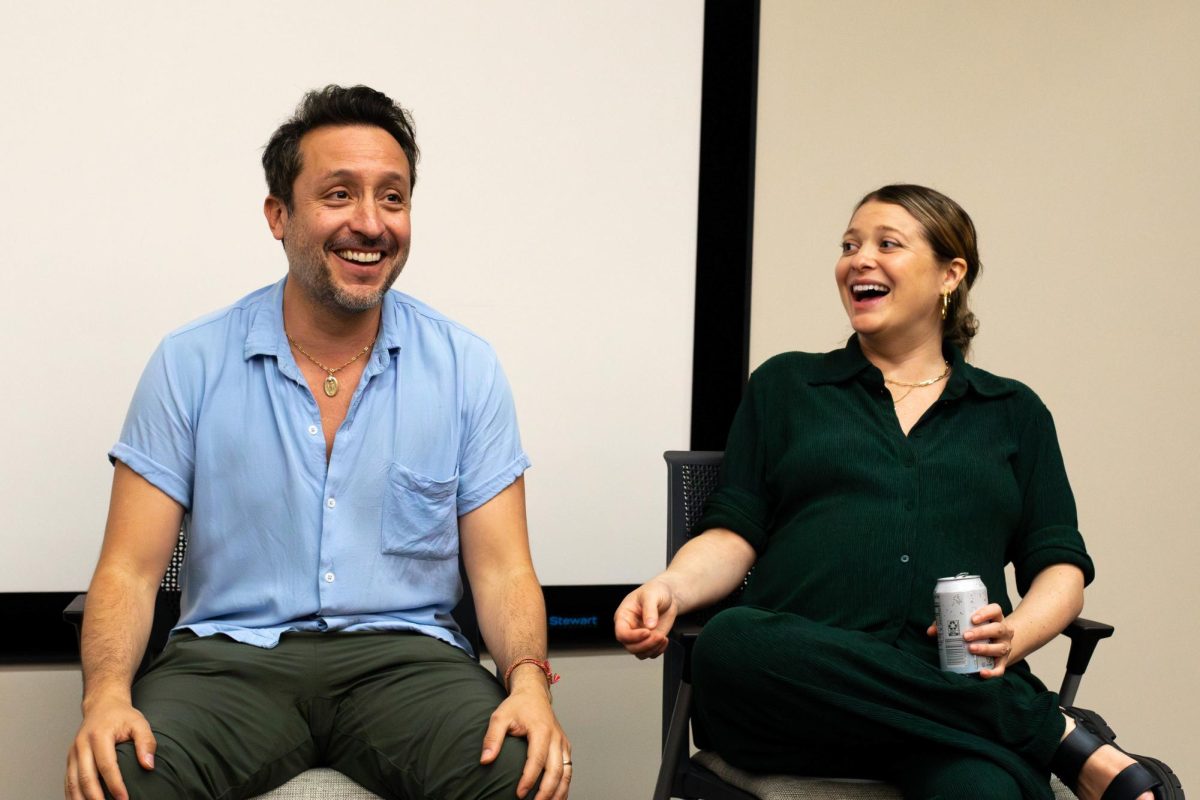 Mean Girls (2024) directors Arturo Perez Jr. and Samantha Jayne laugh Tuesday while answering questions from students and faculty at the Moody College of Communication.
