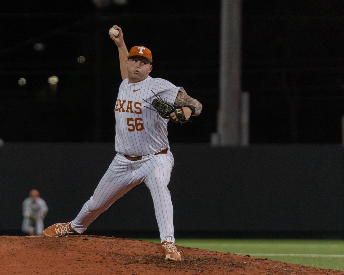 Redshirt sophomore pitcher Gage Boehm pitches during the ninth inning of Texas game against BYU on Friday. Boehm allowed no runs and recorded five strikeouts in the three innings he pitched.  
