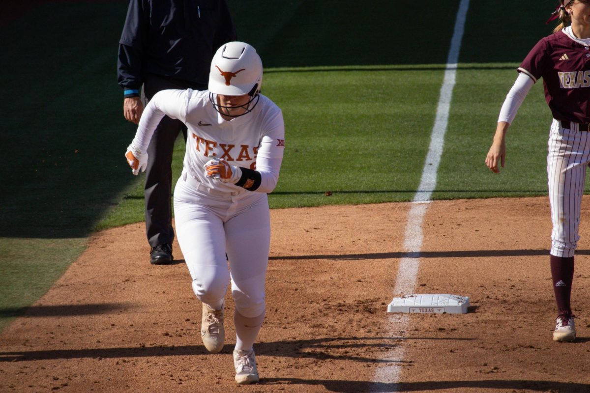 Infielder+Joely+Mitchell+runs+to+home+base+to+score+a+point+for+the+Longhorns+during+Texas+game+against+Texas+State+on+April+10.
