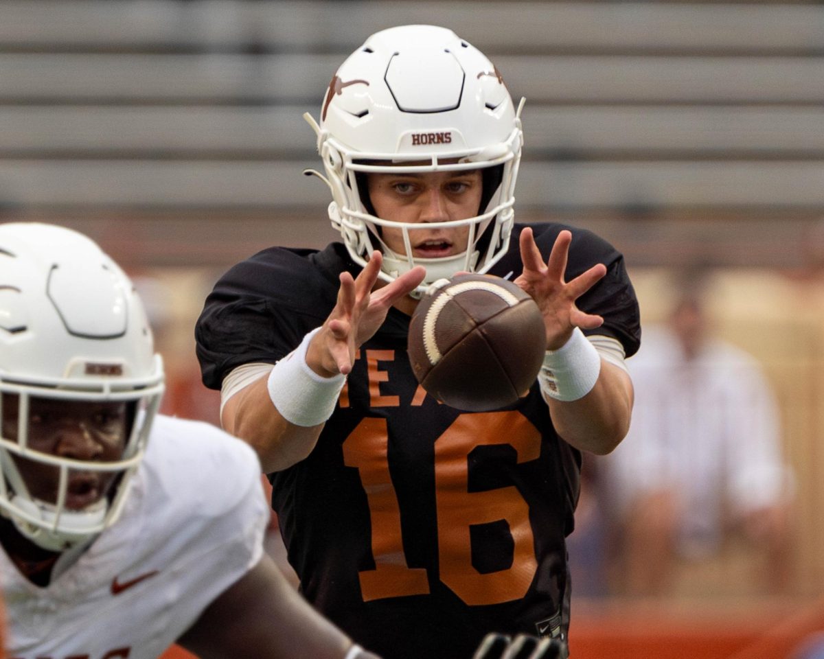 QB2 Arch Manning catches a snap during Texas annual spring game on Saturday.  