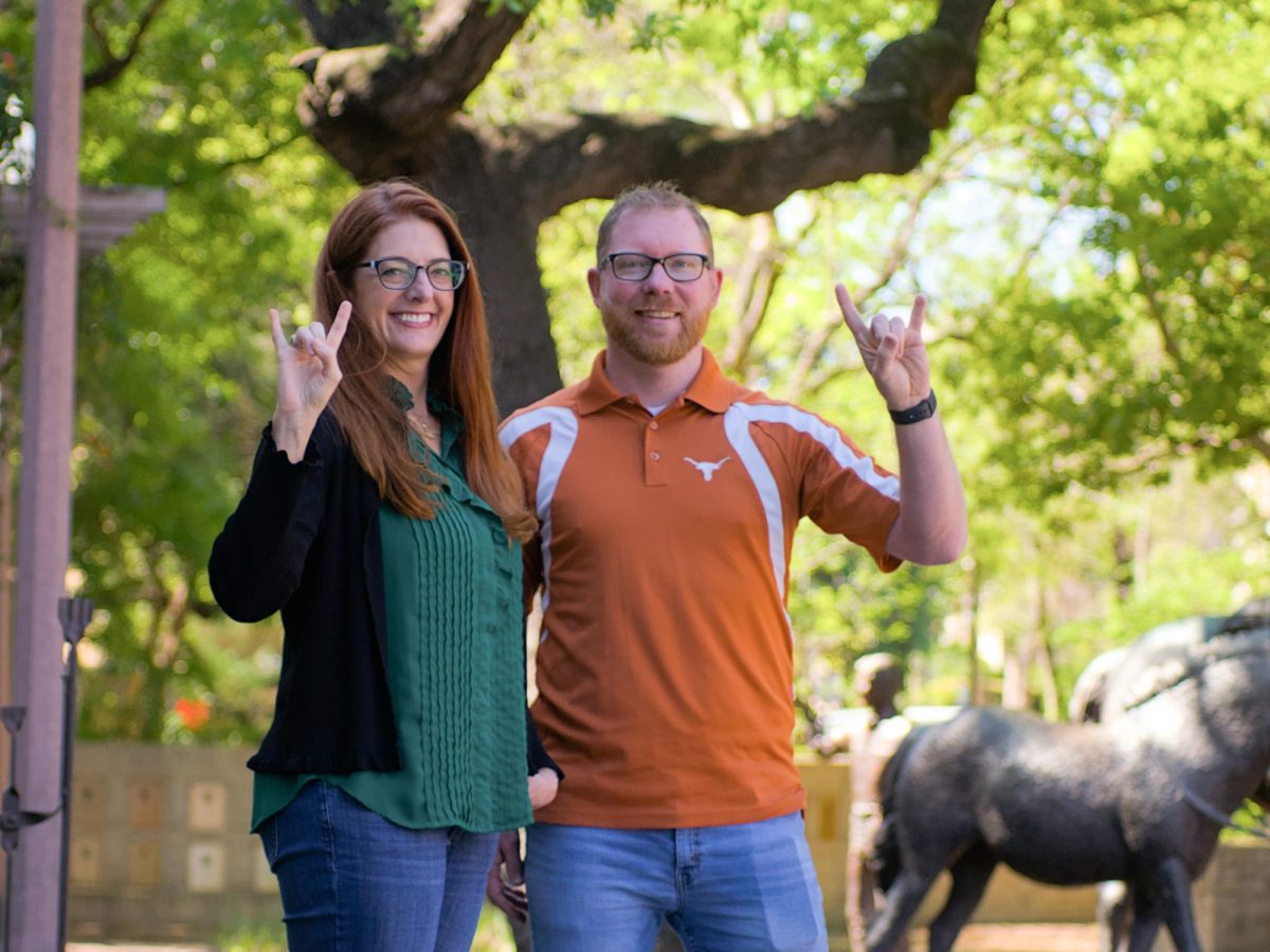 Texas+Exes+VP+of+Marketing+Jamie+Puryear+%28left%29%2C+Membership+and+Alumni+Records+Manager+Matt+Pollock+%28right%29+pictured+outside+the+Alumni+Center+on+3-22-24.+The+Texas+Exes+reaches+100%2C000+members+with+Bevo+as+the+100%2C000th+member.