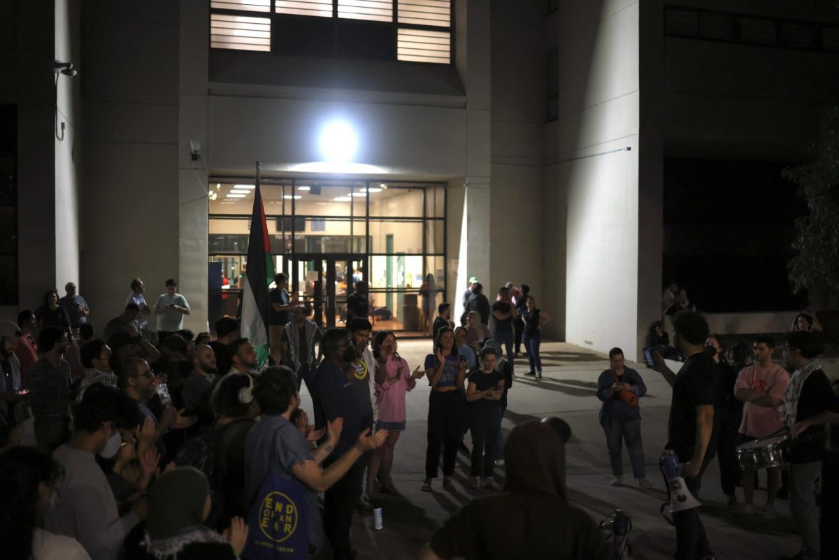 People gather in front of Travis County Jail after arrests were made on the University of Texas at Austins campus Wednesday.