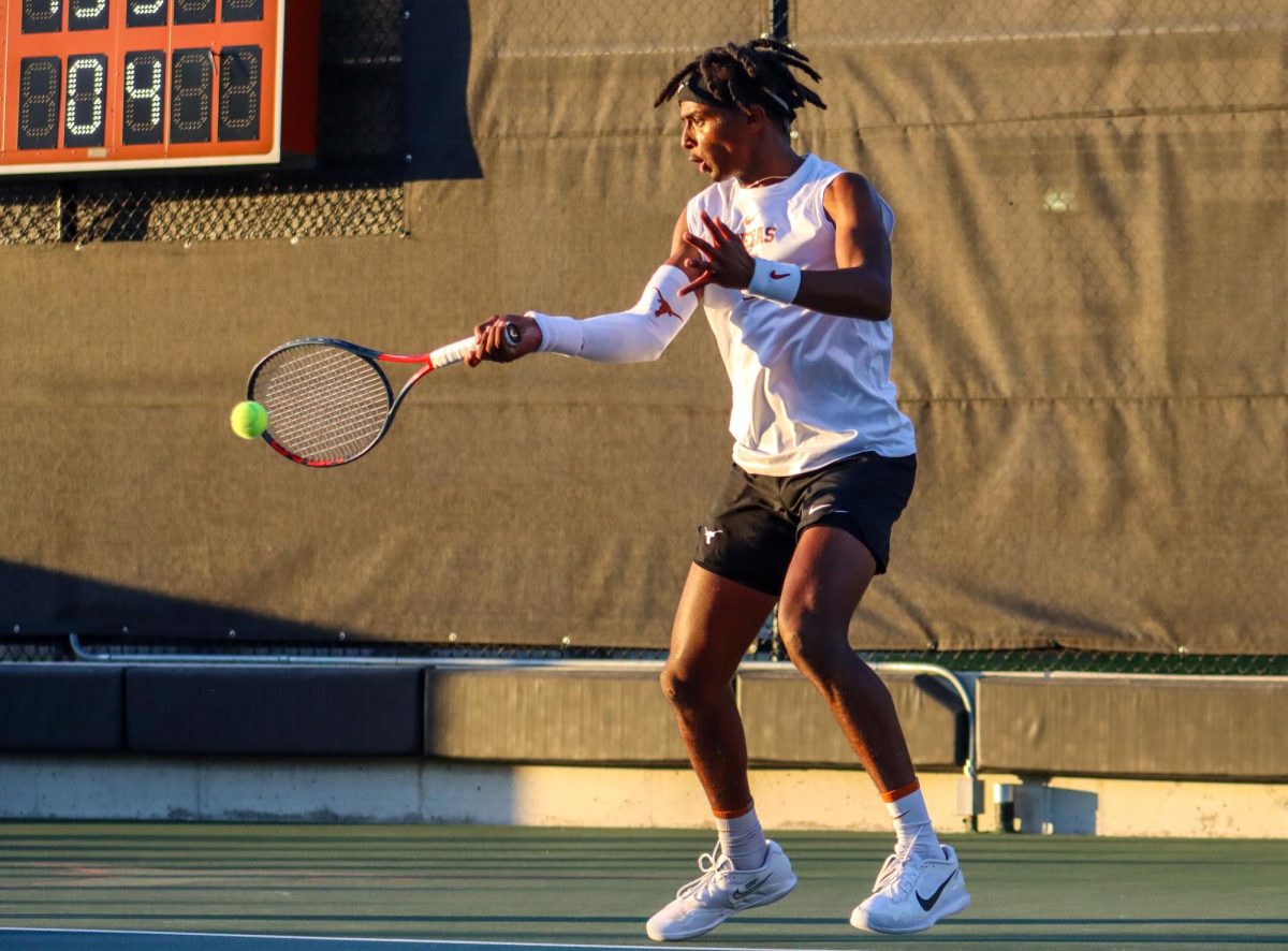 Senior Siem Woldeab hits the ball during doubles against Virginia on Jan. 18, 2024.