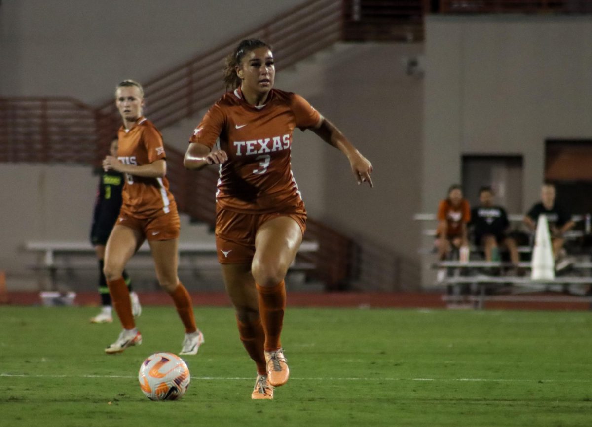 Freshman Arianna Brothers runs with the ball down the field on Oct. 8, 2023 at Texas game against Iowa State.