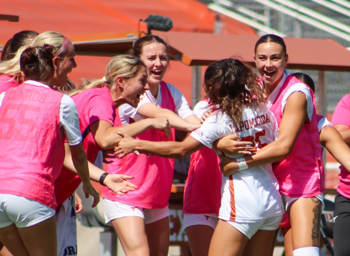 Senior Lauren Lapomarda's teammates surround her after she scored a goal against Iowa State on Oct. 8, 2023.