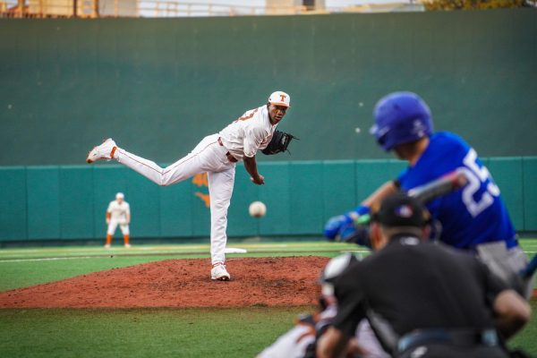 Texas' Lebarron Johnson Jr. pitches against A&M-Corpus Christi on Feb. 21, 2022. Texas defeated A&M-Corpus Christi 12-2.