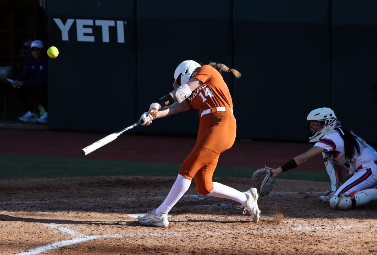 Sophomore+first+baseman+Reese+Atwood+hits+the+ball+during+Texas+game+against+Northwestern+State+on+March+1%2C+2024.