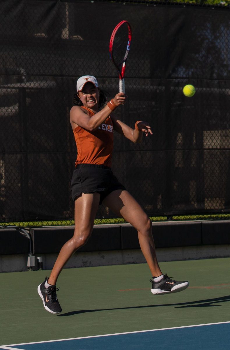 Senior Charlotte Chavatipon hits the ball during singles play against Oklahoma State on March 22, 2024.