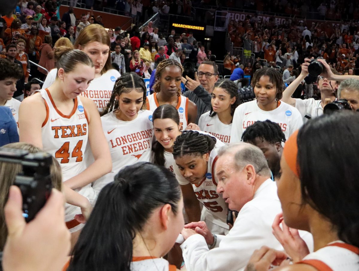 Head+coach+Vic+Schaefer+talks+with+his+team+on+March+24%2C+2024%2C+after+the+Longhorns+beat+Alabama+in+the+second+round+of+the+March+Madness+tournament.