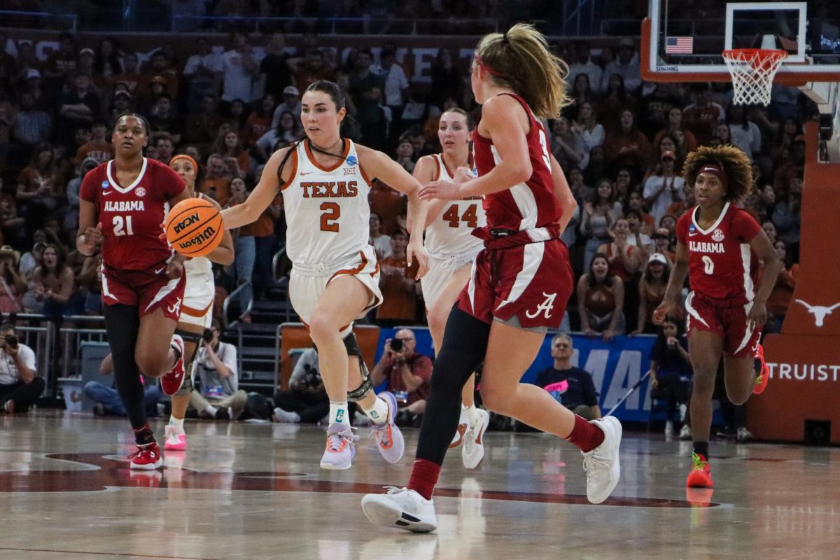 Graduate Student guard Shaylee Gonzales evades opponents as she dribbles the ball across the court on March 24, 2024. Gonzales had three steals and two assists in the second round game against Alabama, to help the Longhorns win 65-54.
