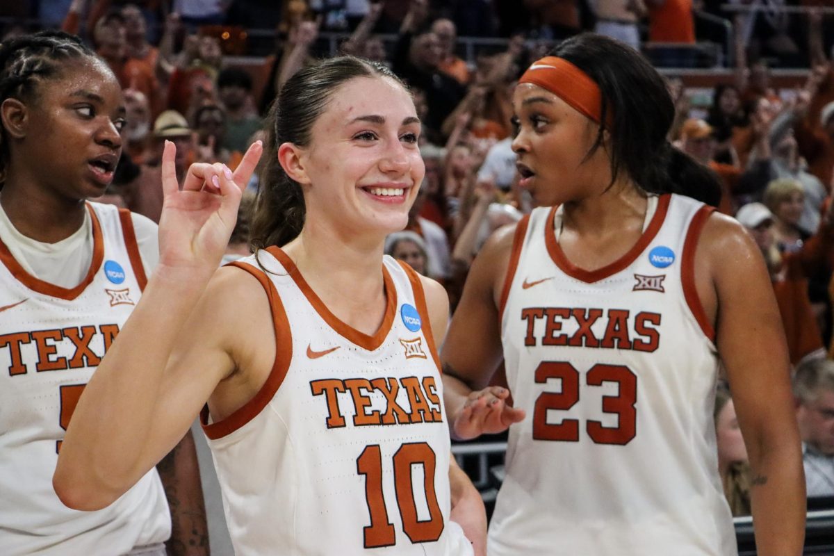 Senior Shay Holle smiles and throws up her horns after defeating Alabama in the second round of March Madness on March 24, 2024.