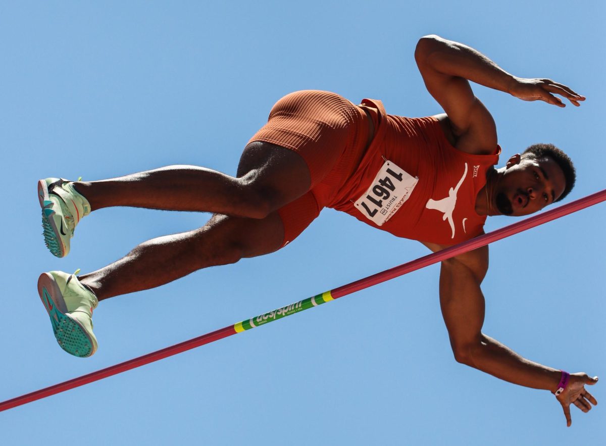 Senior Leo Neugebauer floats over the bar during the pole vault event of the decathlon on March 28, 2024. Neugebauer placed first in the pole vault with a height of 5.1 meters at the Clyde Littlefield Texas Relays.