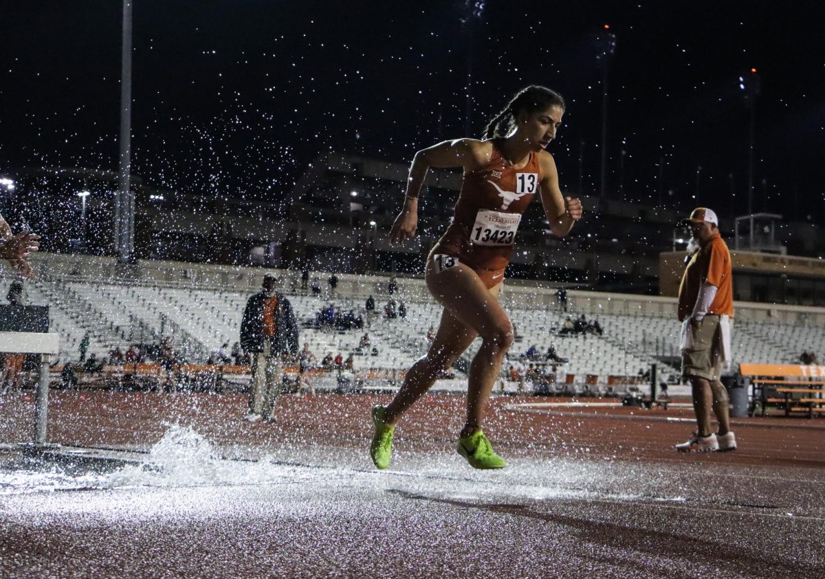 Junior+Allyson+Little+runs+out+of+the+water+pit+during+the+3000-meter+steeplechase+event+on+March+28%2C+2024%2C+at+the+Clyde+Littlefield+Texas+Relays.+Little+won+the+race+with+a+time+of+10%3A41.57.