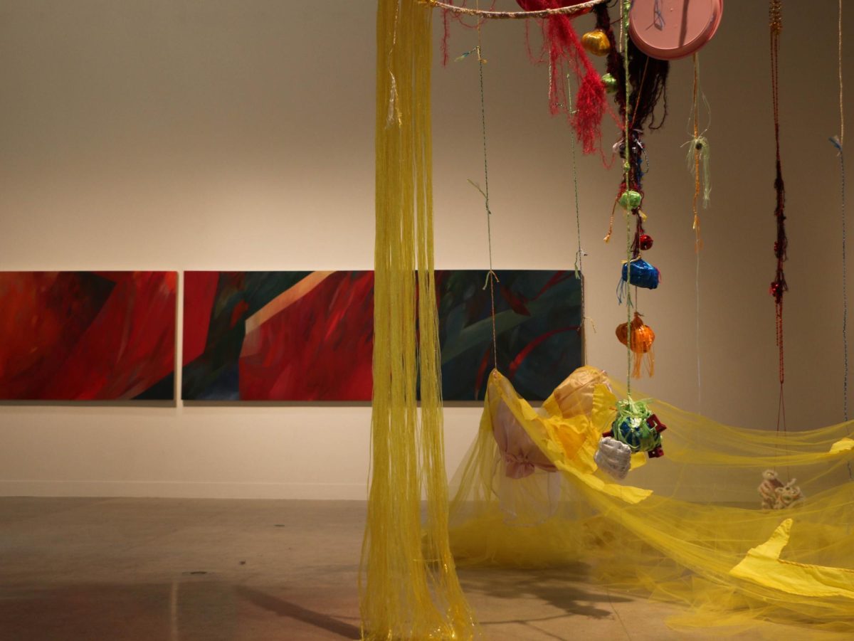 Sculptures by Irene June and oil paintings by McKenzie Drake are on display in UT’s Visual Arts Center on Thursday. The pieces are part of the 2024 Studio Art MFA Thesis Exhibition.