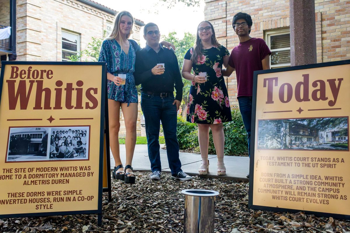 From left, Adriana Abril, Ivan Djordjevic, Jenna Leslie, and Kavish Dewani smile near the Whitis Court Time Capsule after placing a polaroid photo in the time capsule on Apr. 18, 2024.