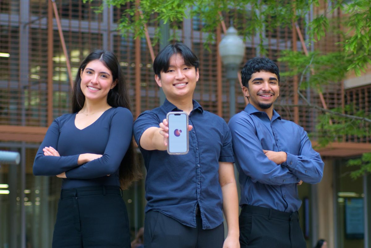 Salette Rios (left), Philip Baek (middle), Mario Hernandez (right) who make up part of the team behind the BoBo app pose for a portrait at the GDC on Tuesday. The BoBo App developed by students at UT helps roommates manage their relations.
