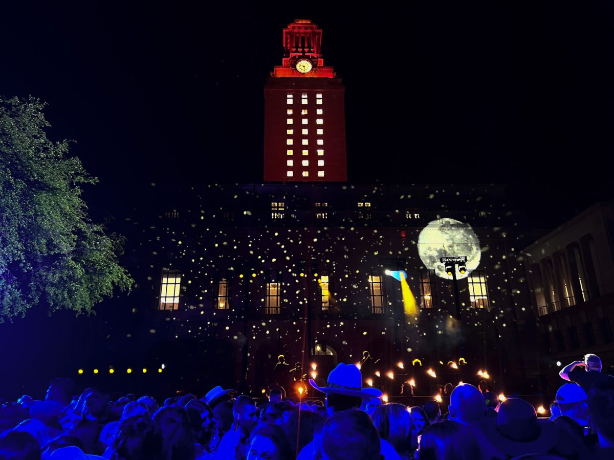 Graphics are projected on the tower for the CMT Music Awards outdoor stage on Wednesday. This event was one of many held on the UT campus during the CMT Music Awards.