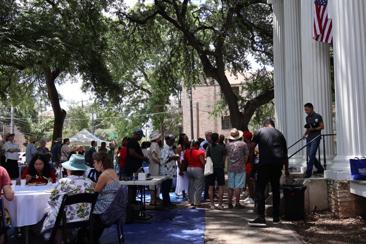 eople gathering to socialize and eat at the Neill-Cochran House Museum’s Juneteenth event on Saturday.