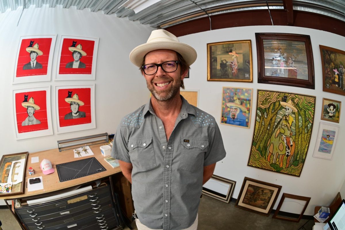 Artist Jason Archer poses for a portrait in his Austin studio on June 25, 2024.