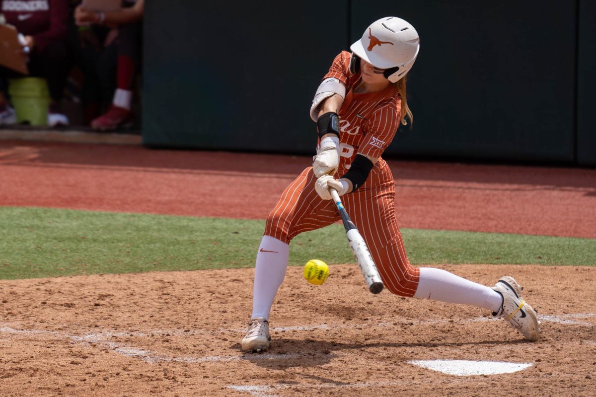Outfielder Bella Dayton swings at a pitch during Texas game against Oklahoma on April 7, 2024.  
