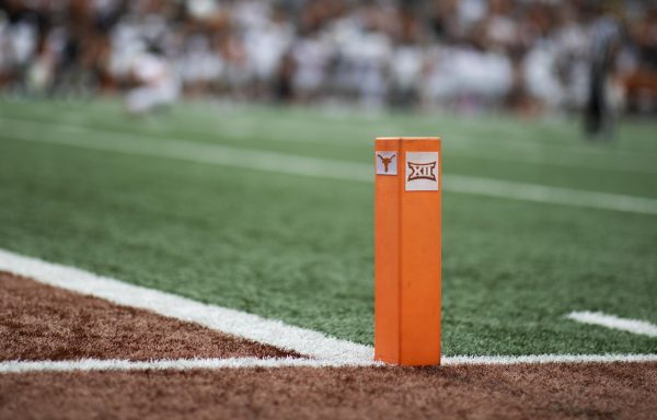 A marker displaying the Longhorn and Big 12 logos on the field during Texas' spring game on April 20, 2024.