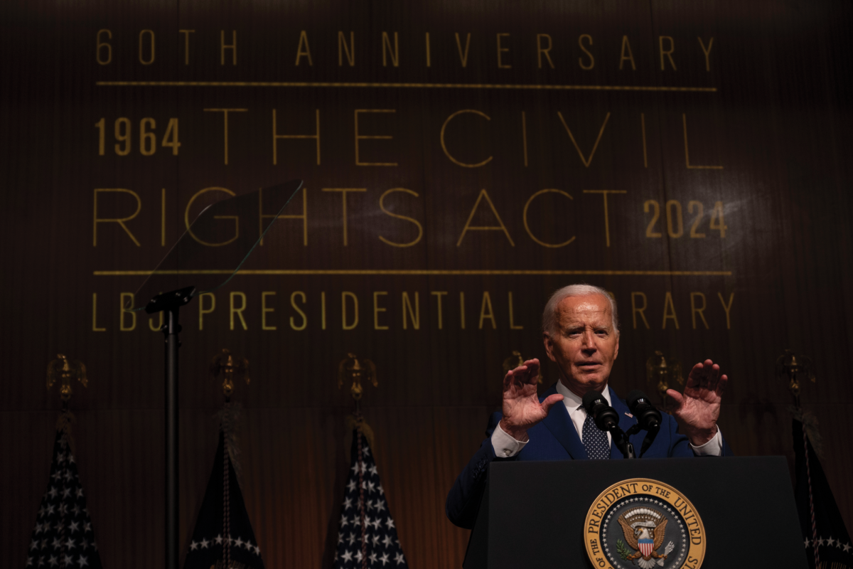 President Biden speaks at the LBJ Library on UT Austin's campus to commemorate the 60th anniversary of the Civil Rights Act on Monday. He also called for Supreme Court reform, addressing an audience of about a thousand.