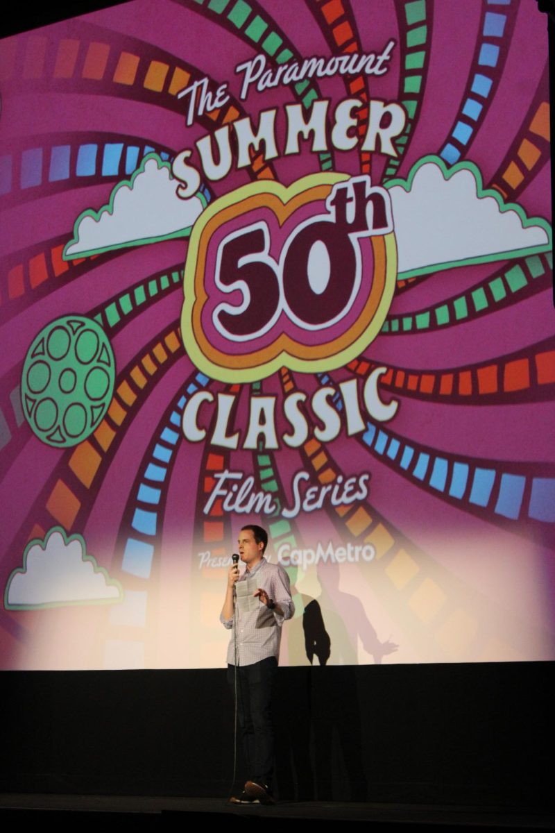 Stephen Jannise, Paramount Theatre director of film programming and content strategy, addresses the audience before a Summer Classic Film Series screening of Steel Magnolias on August 22, 2024.