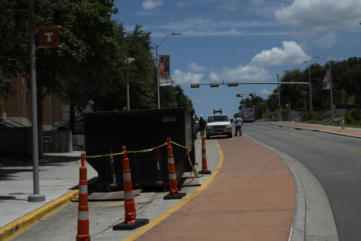 Loading vehicles pictured near the DKR Stadium adjacent bike lanes on Robert Dedman Drive on Friday, August 2, 2024.