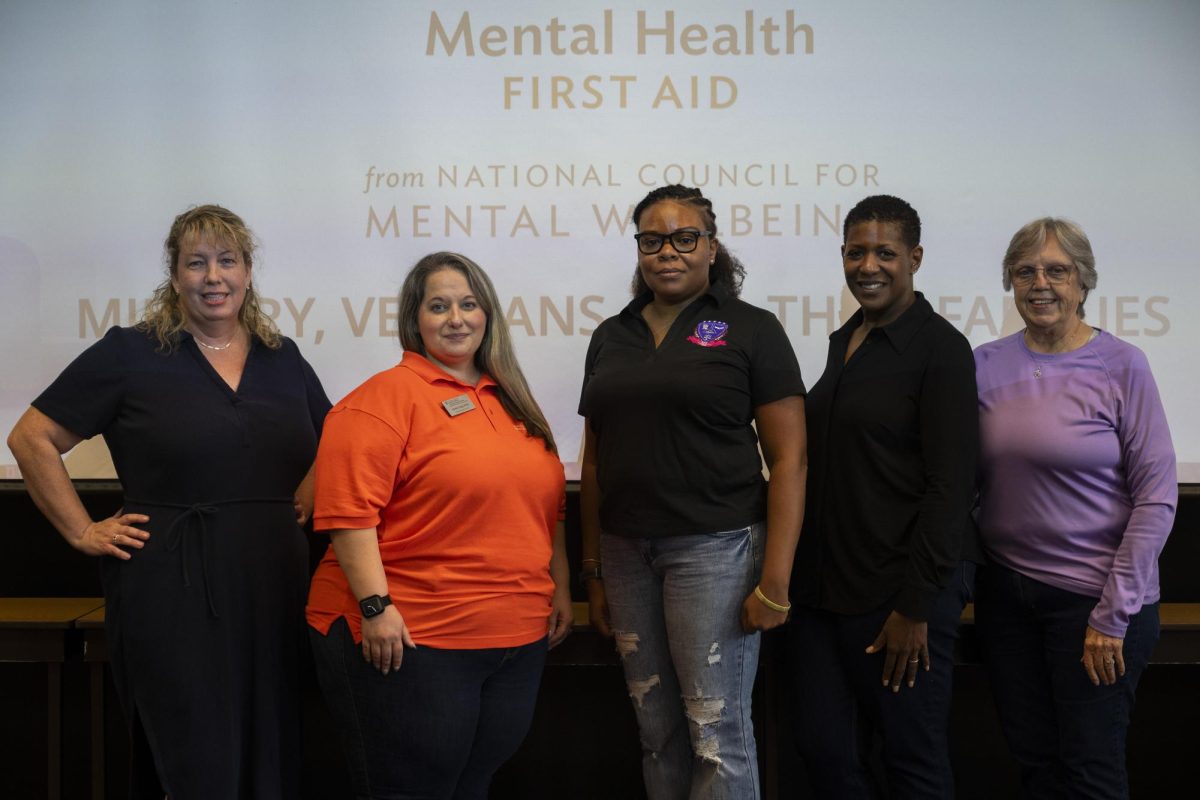 Ashley Craig, second from left, leads a mental health training for veterans and their relatives Friday in John W. Hargis Hall.