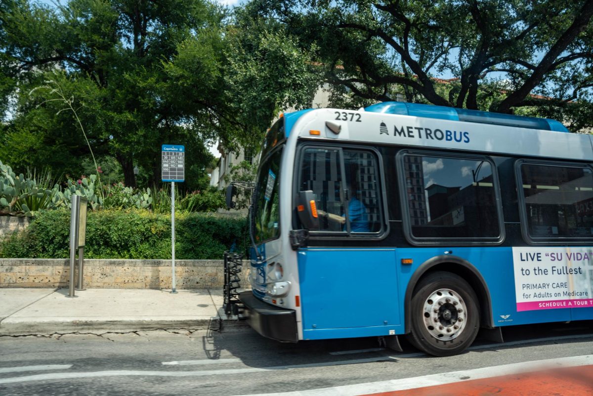 A CapMetro Bus slows down in front of a bus stop on Guadalupe Street on Aug. 5, 2024. 