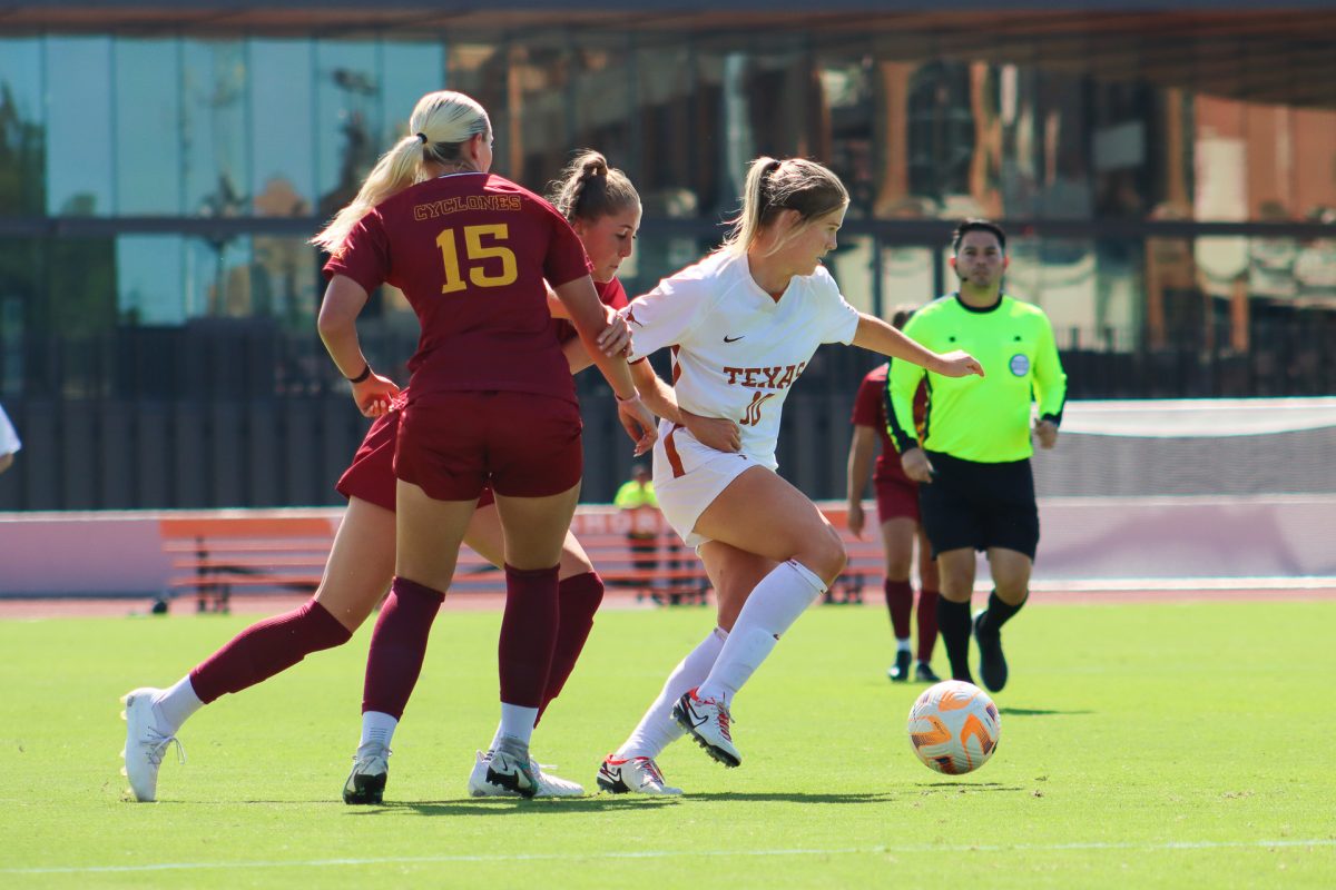 Senior midfielder Lexi Missimo breaks free from her opponents on Oct. 8, 2023 during Texas' game against Iowa State.