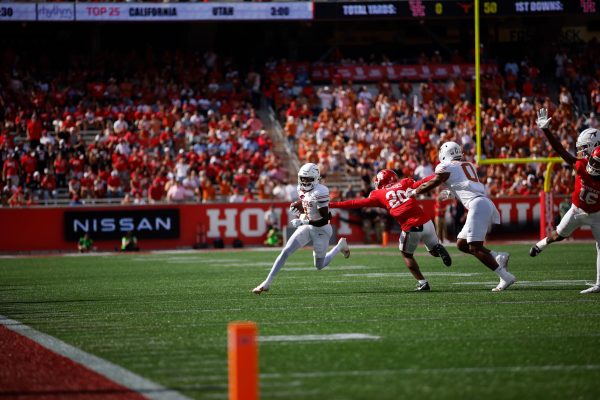 Wide receiver Xavier Worthy runs past Houston defender on Oct. 21, 2023.