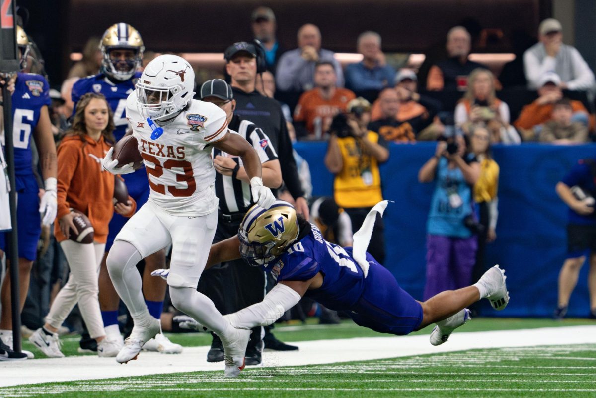 Junior running back Jaydon Blue runs a play down the field during the Allstate Sugar Bowl game against Washington on Jan. 1, 2024. 