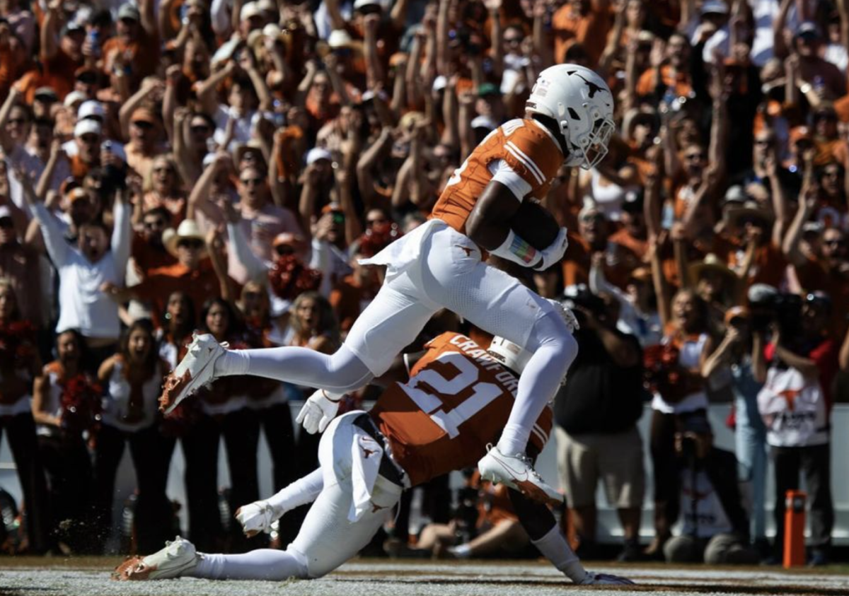 Defensive back Malik Muhammad recovers a blocked punt in the end zone and scores a touchdown during Texas' game against Oklahoma on Oct 7, 2023.