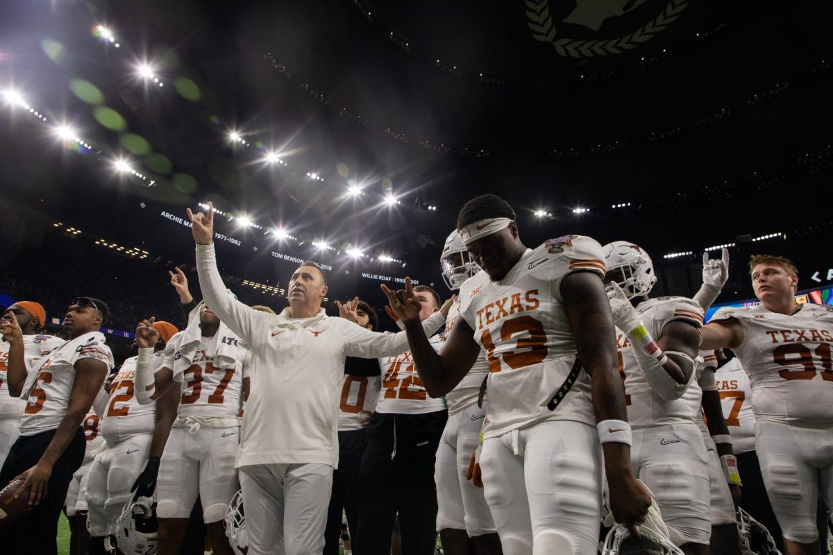 Coach Steve Sarkisian sings the Eyes of Texas for the last time this season with his team and Texas fans after the Longhorns' loss to the Huskies on Jan. 1, 2024. The Horns ended their season 12-2, their best since 2009 and Sarkisian's best at Texas.