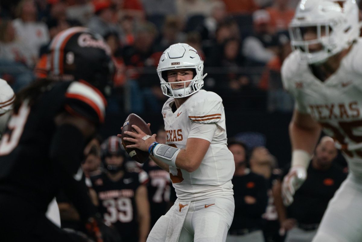 Quarterback Quinn Ewers looks for a teammate to pass to during the Big 12 championship game on Dec. 2, 2023. 