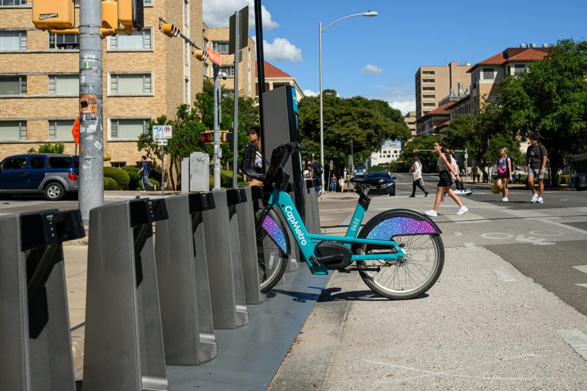 A single CapMetro e-bike remains at UT's BikeShare station at the corner of Dean Keaton Street and Whitis Avenue on August 29, 2024.