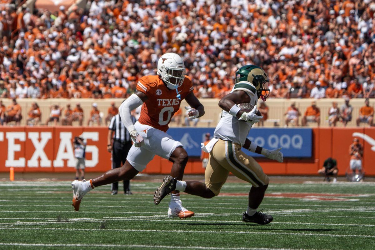 Sophomore linebacker Anthony Hill Jr. runs to tackle a CSU player during Texas' game against the Rams on Aug. 31. 