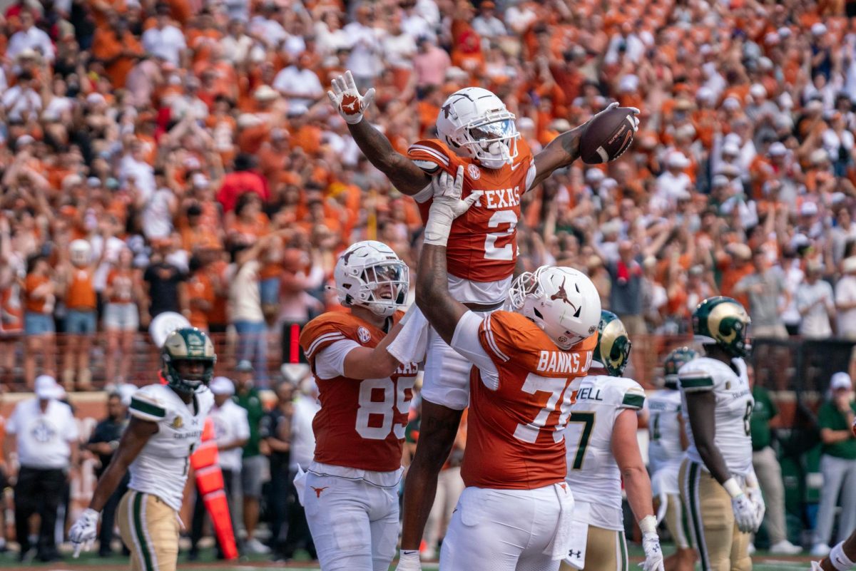 Junior wide receiver Matthew Golden celebrates a touchdown with his teammates during Texas' game against CSU on Aug. 31, 2024. 