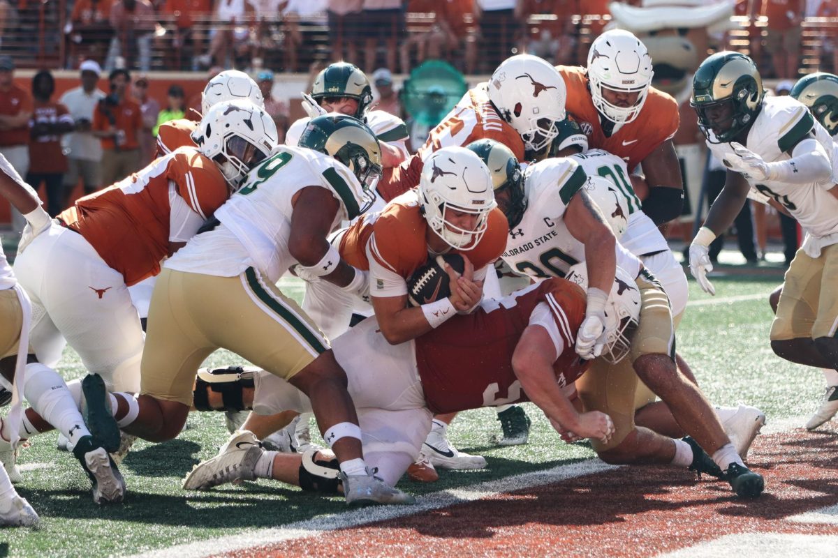 Quarterback Arch Manning pushes his way into the end zone to score a touchdown in the third quarter of the game against Colorado State on Saturday.