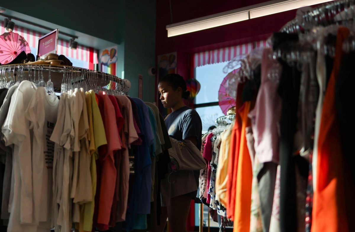 Shayla McCain shops at Out of the Closet, a new thrift store on Guadalupe St., on August 12, 2024.