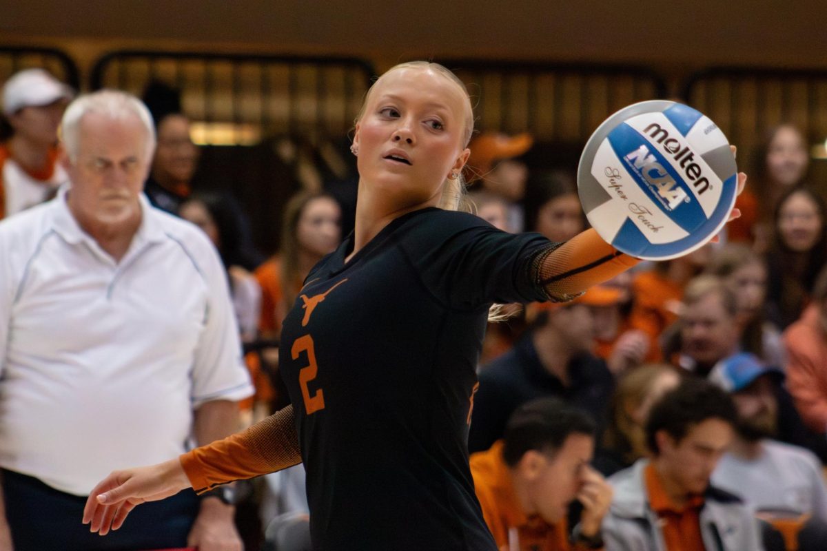 Emma Halter holds the ball before serving it during a home game against Texas State on Feb. 29, 2024.