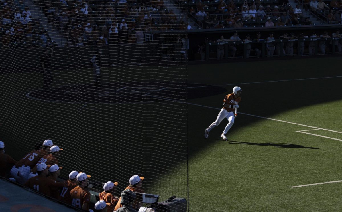 Jared Thomas runs downfield after hitting a home run during Texas' game against Cal Poly on Feb. 24, 2024. 