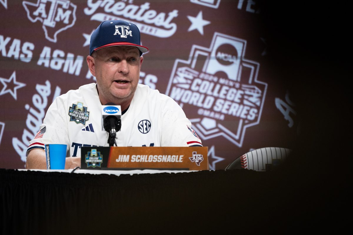 Texas A&amp;M head coach Jim Schlossnagle (22) speaks at a postgame press conference after Texas A&amp;M’s win against Florida at the NCAA Men’s College World Series at Charles Schwab Field in Omaha, Nebraska on Sunday, June 15, 2024. (Chris Swann/The Battalion)