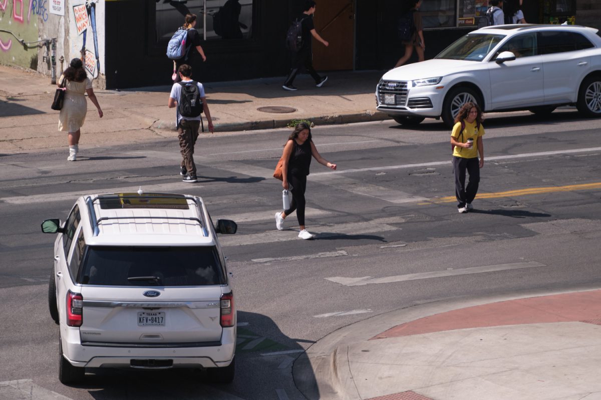 Pedestrians cross Guadalupe st. to campus on Sept. 13.