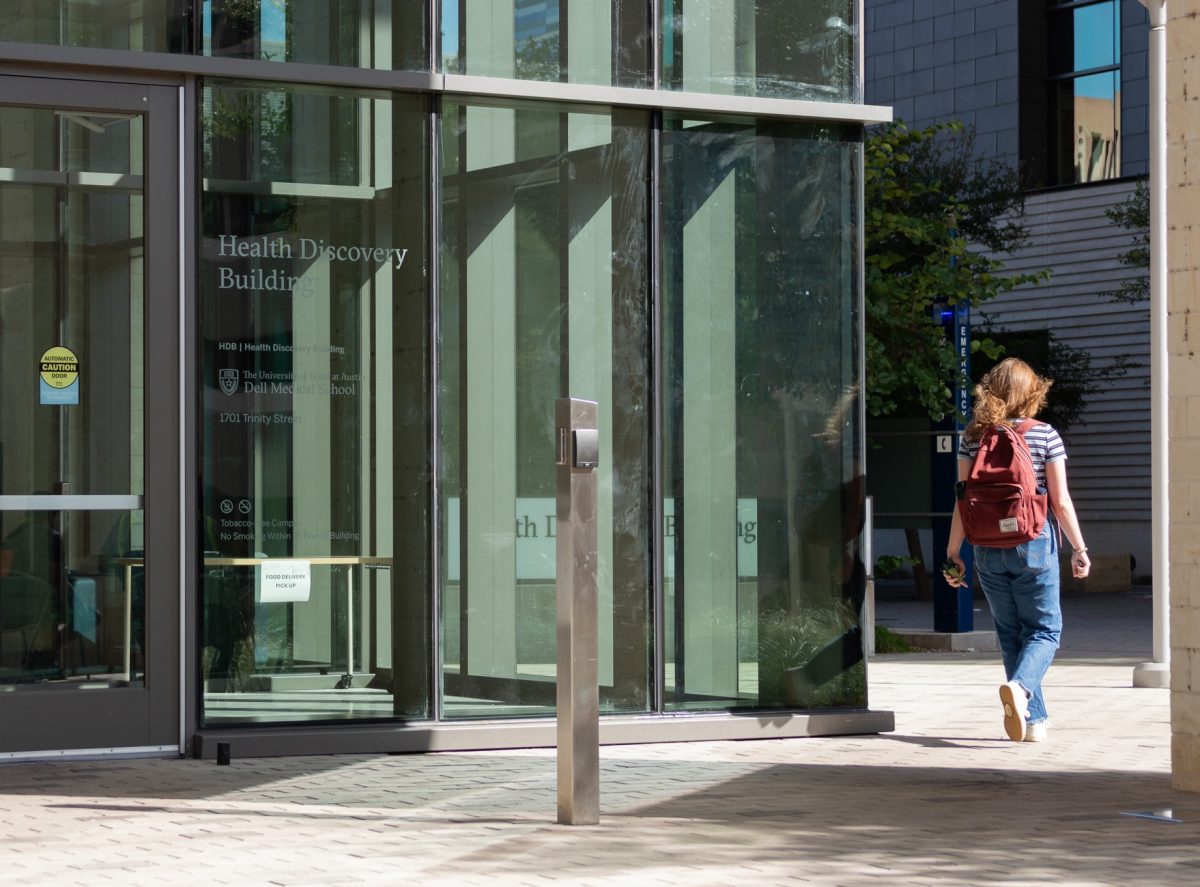 A student leaves the Health Discovery Building, part of the Dell Medical School, on September 25, 2024.